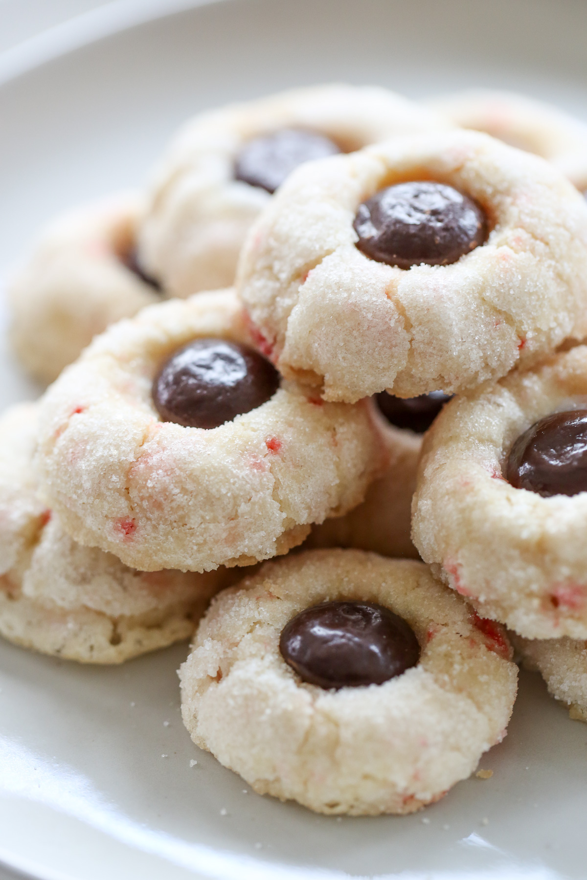 candy cane cookies stacked on a plate