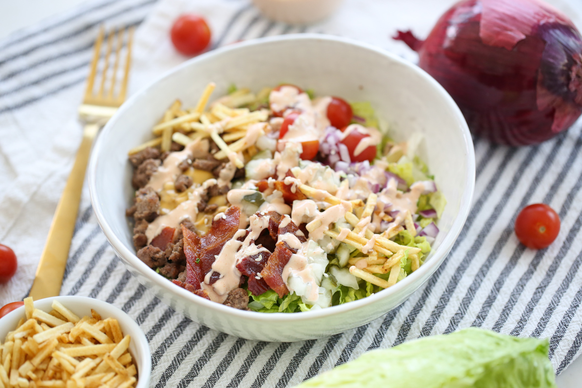 Salad ingredients in a bowl with dressing
