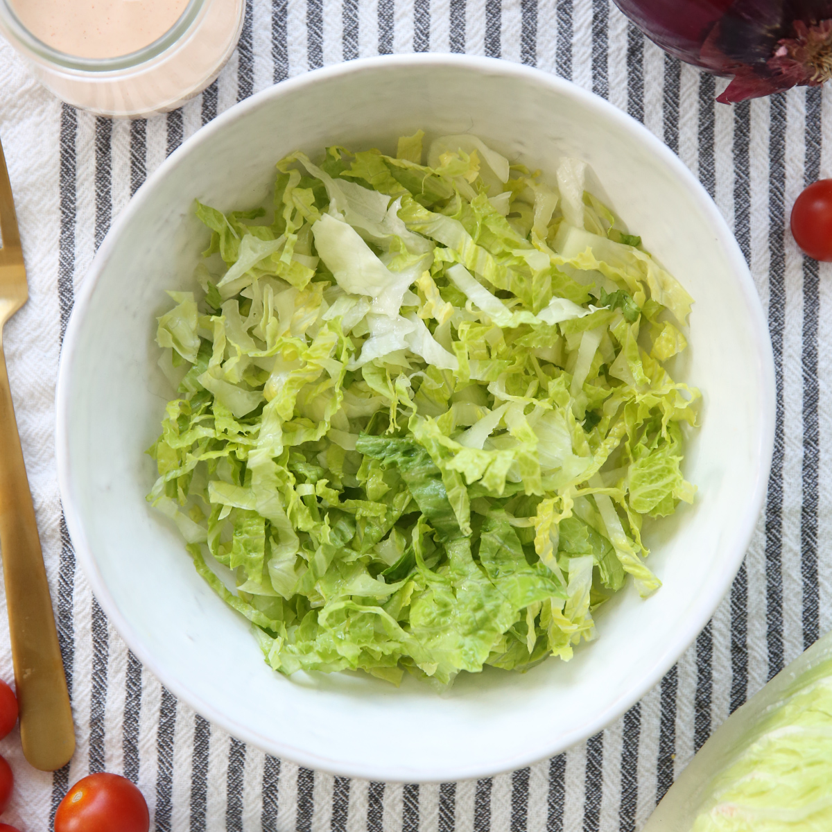 shredded ice berg lettuce in a bowl