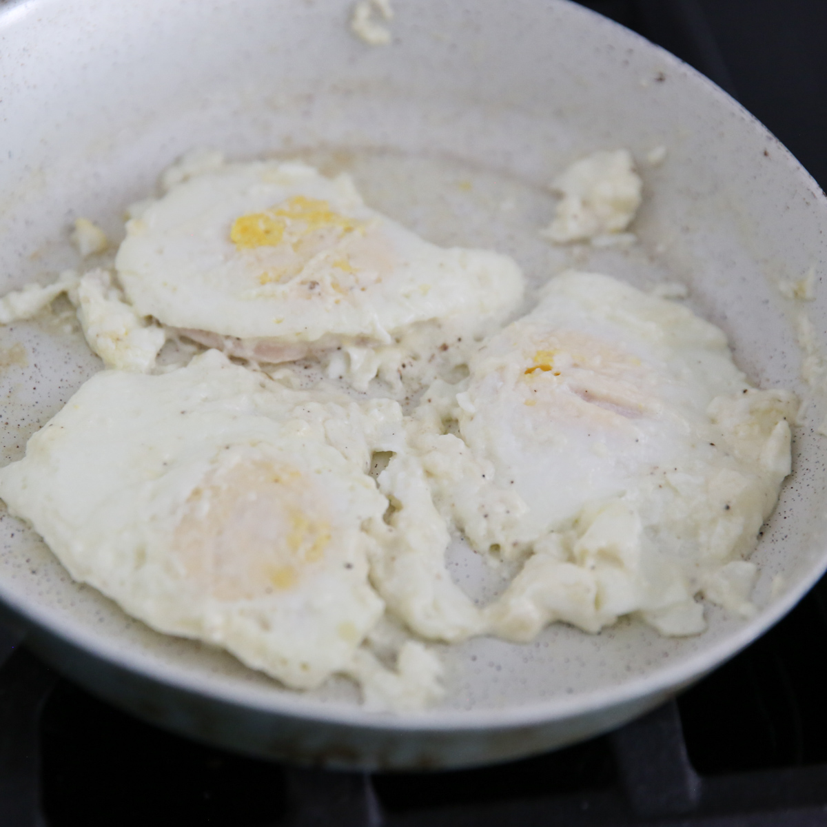 eggs fried in a skillet