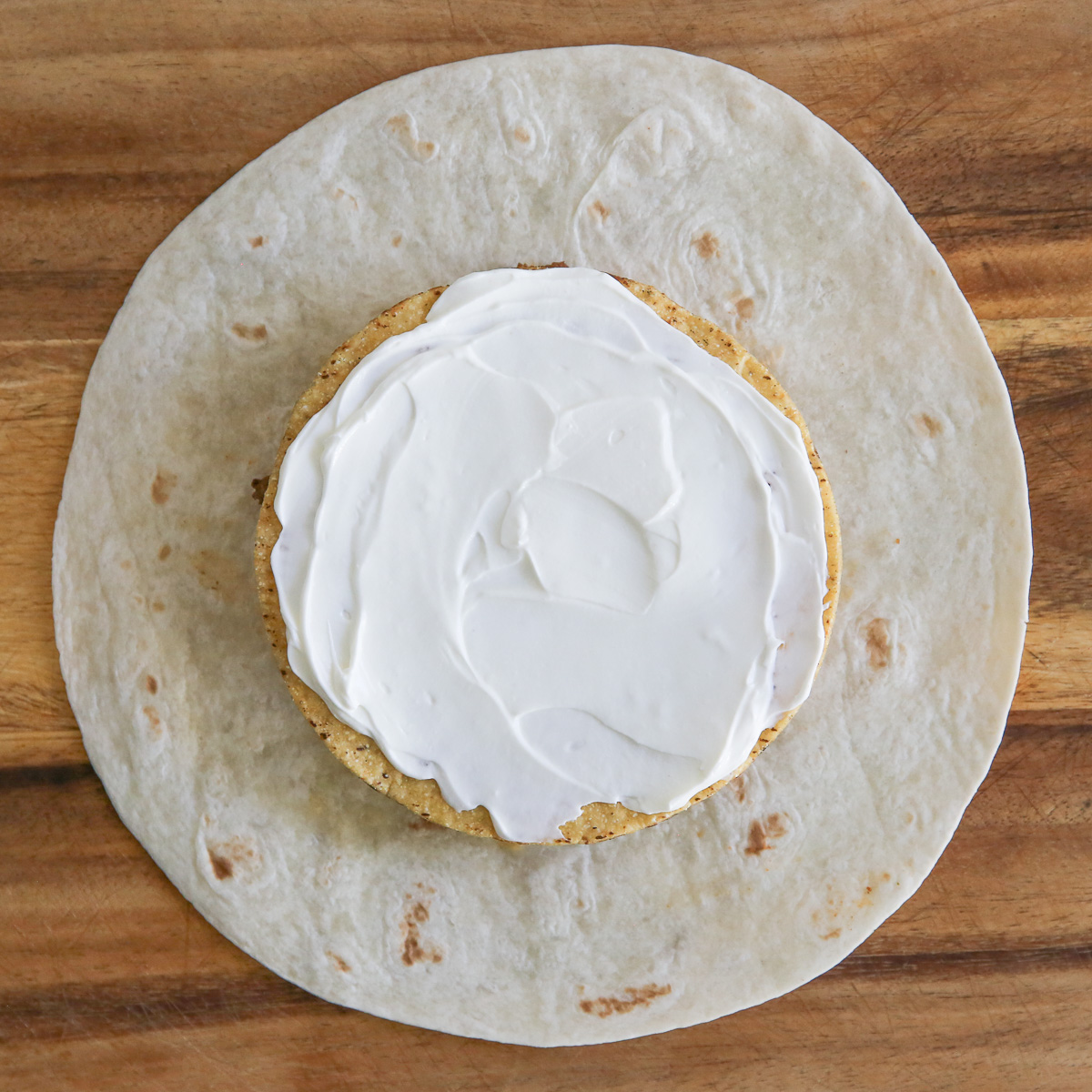 sour cream on a crispy tortilla
