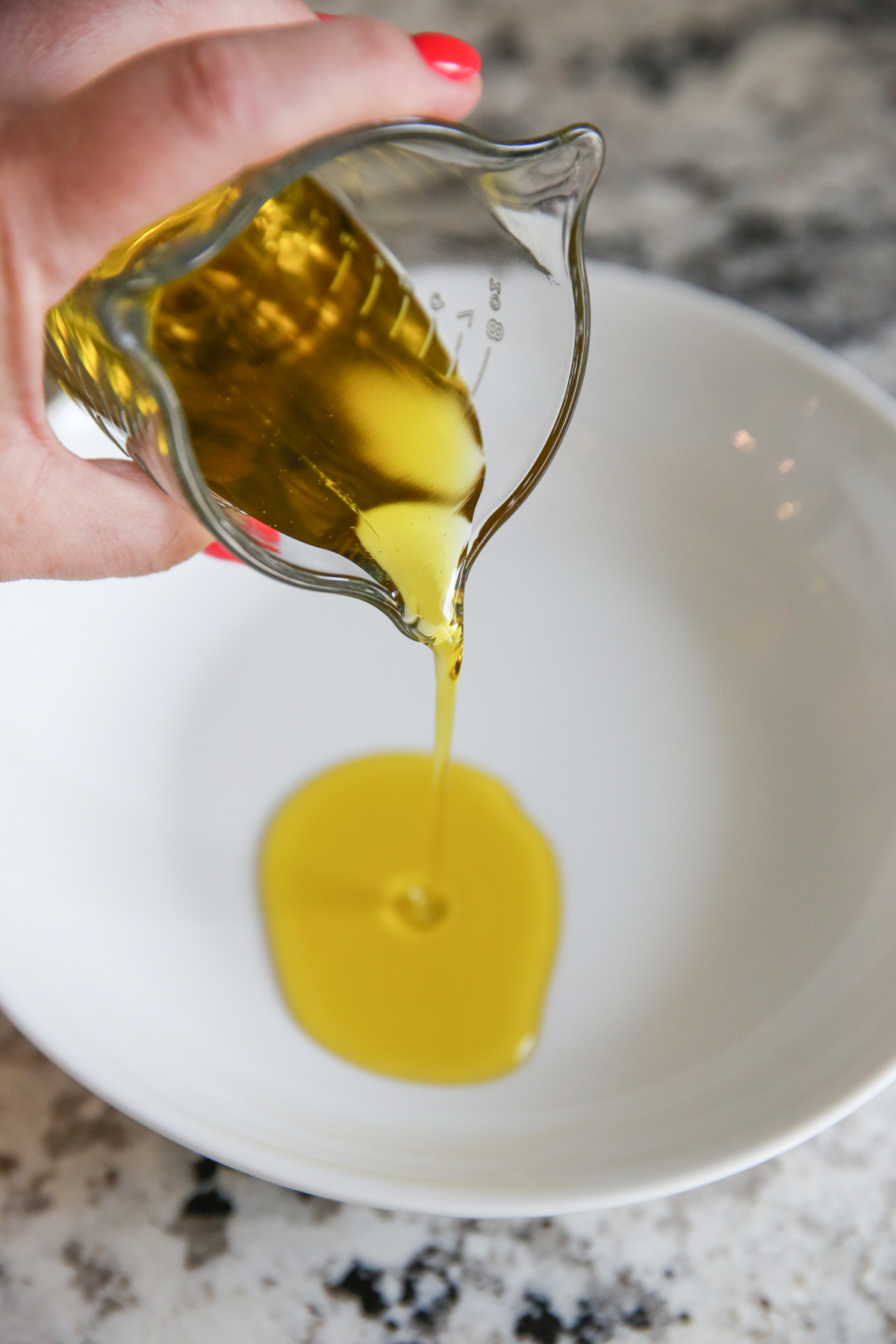 pouring dipping oil into a bowl