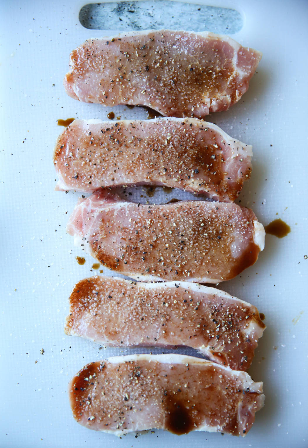 salt and pepper on pork chops