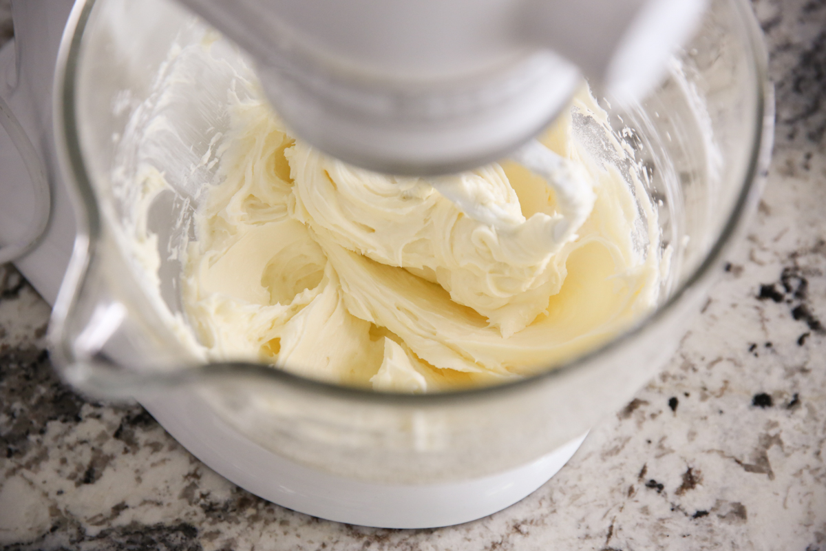 cheesecake batter mixing in a stand mixer