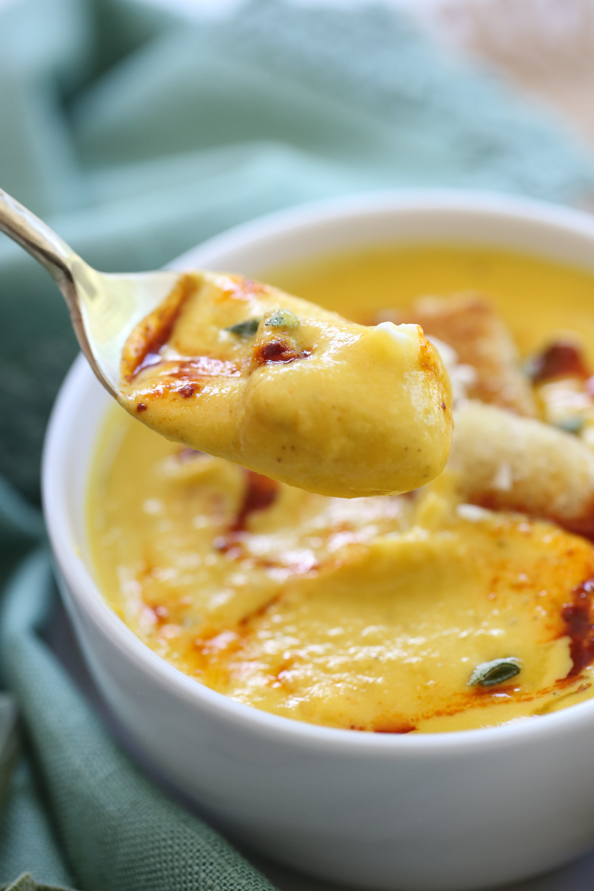 spoonful of squash soup with feta