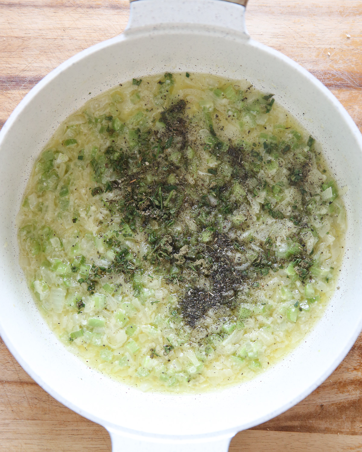 celery and onion in butter with herbs
