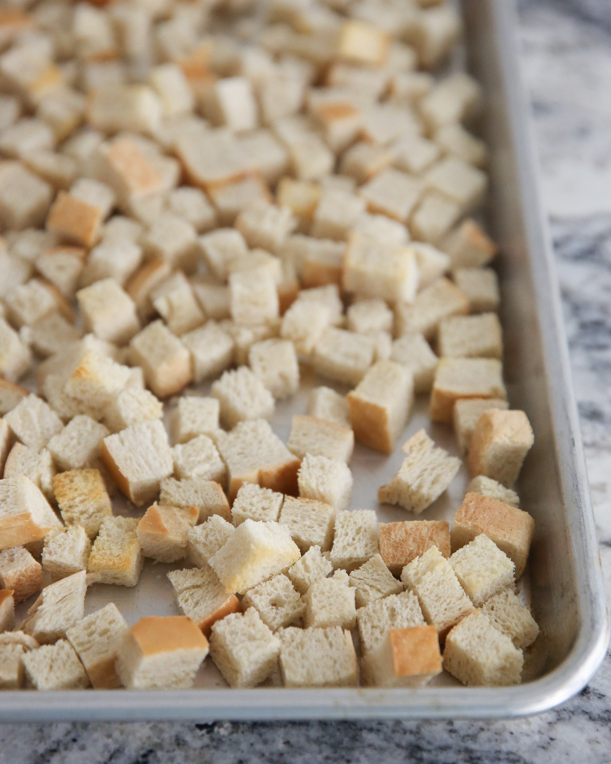 toasted bread cubes on a baking sheet