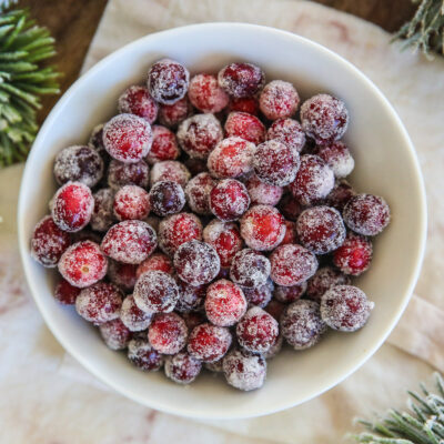 bowl of fresh cranberries covered in sugar