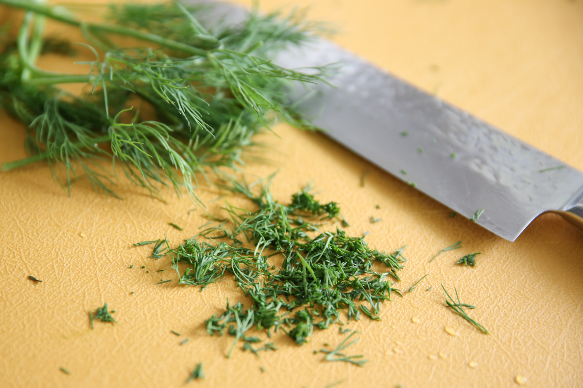 fresh chopped dill on cutting board