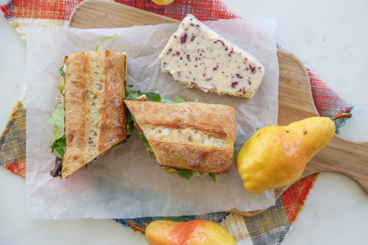 Turkey and Pear sandwich on a cutting board