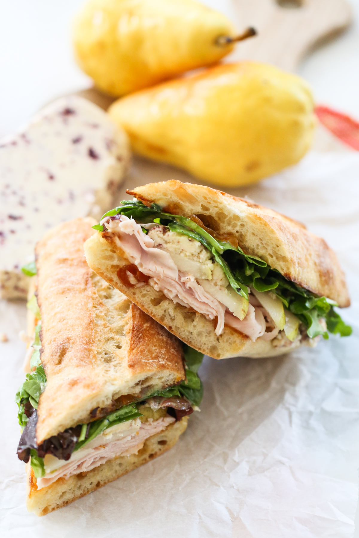 Turkey and Pear Sandwich on a cutting board