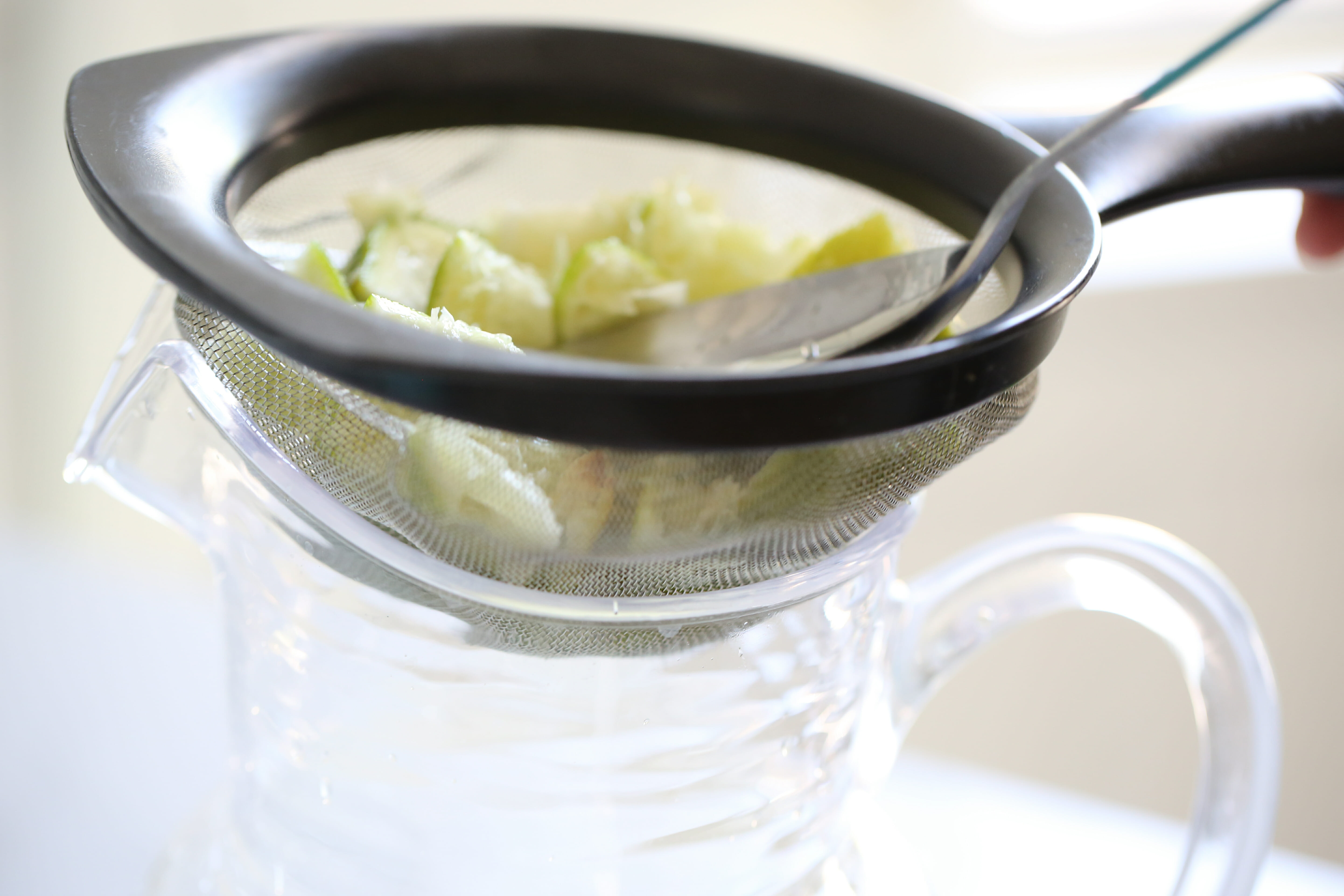 straining lime juice
