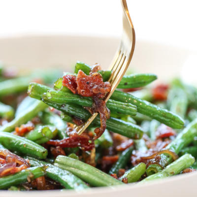 green beans with bacon on a fork